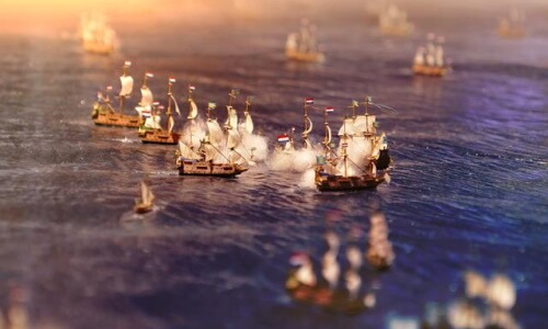 miniature terrain of ships on sea that can help you learn how to play